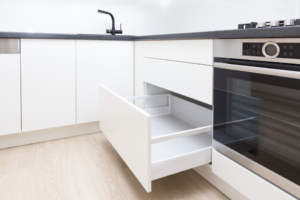 a kitchen with handleless cabinets