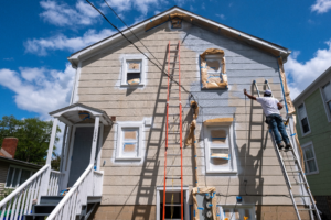 a team painting the outside of a house